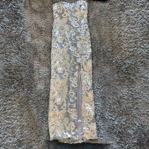 silver floor length fitted ball gown w/ a slit